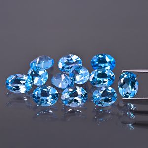 Pierre ovale, cône - topaze bleu Swiss 7x5 MM
